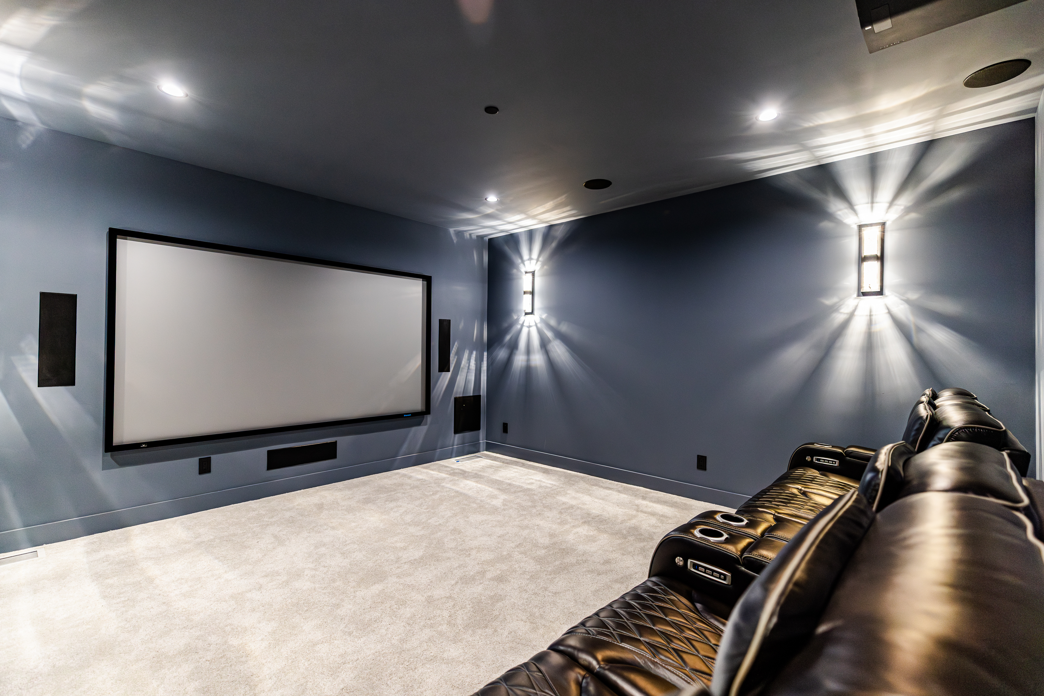 Home theater electrical installation with surround sound and wall sconces