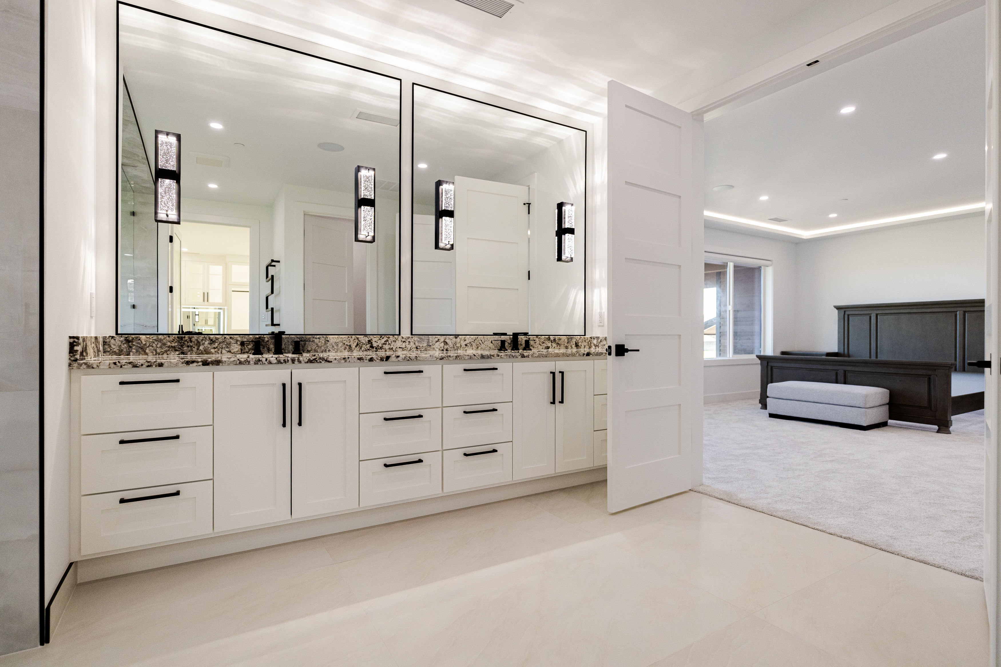 Double vanity lighting installation in a luxury custom home