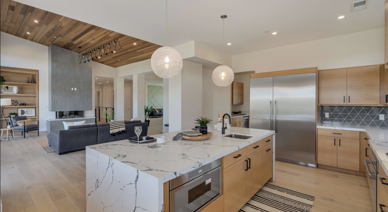 Modern kitchen with pendant lights, recessed lighting, and custom electrical installation